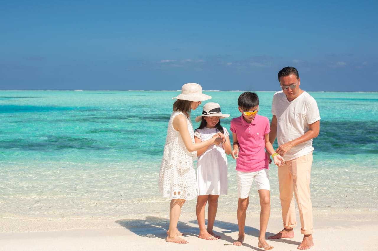 why-choose-us Happy family bonding on a sunny beach, capturing fun moments during summer vacation.